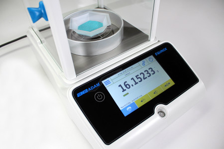 Blue Powder Sample Being Weighed on Equinox Analytical Balance