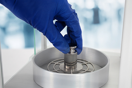 Calibration Weight Being Used in Laboratory
